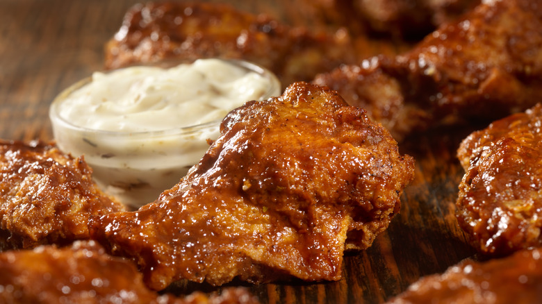 Close-up of hot wings and ranch dressing