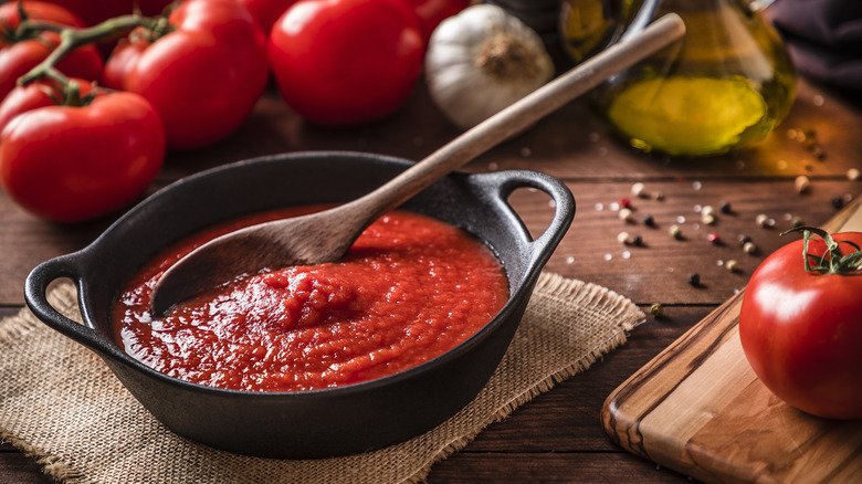 wooden spoon in tomato sauce