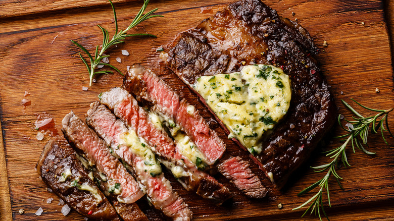 Steak with compound butter, herbs