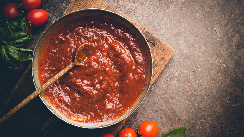 Tomato sauce on dark background