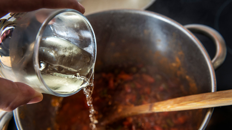 Chef cooking with wine