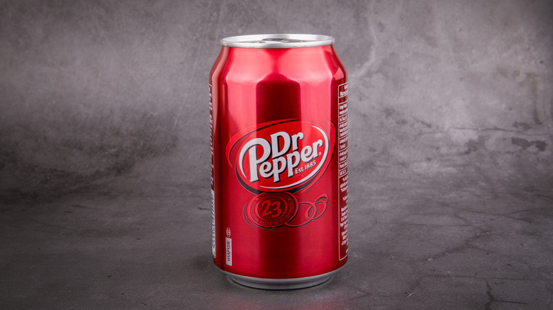 can of dr pepper on charcoal background