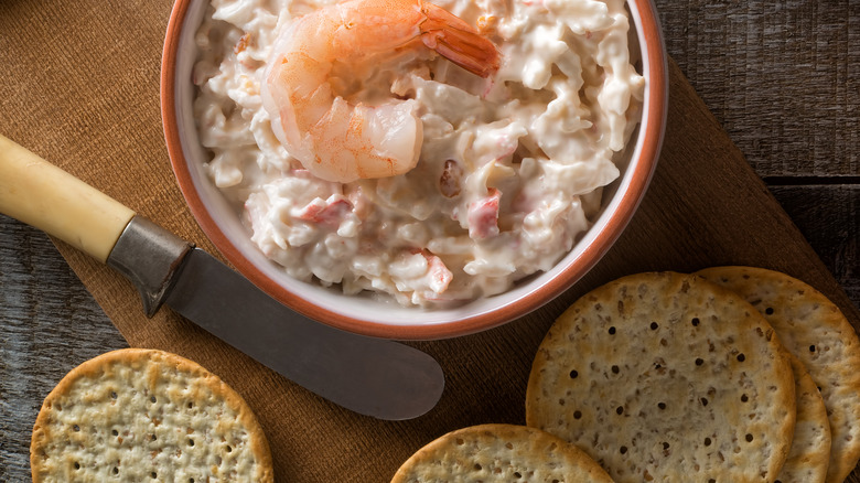 Shrimp dip and crackers with butter knife