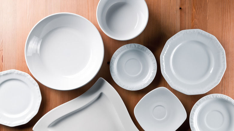 Assortment of white plate on table