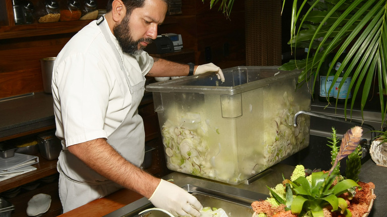 Chef Enrique Olvera plates his food