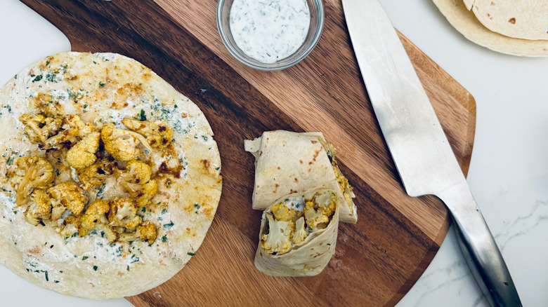 assembling cauliflower wraps on board