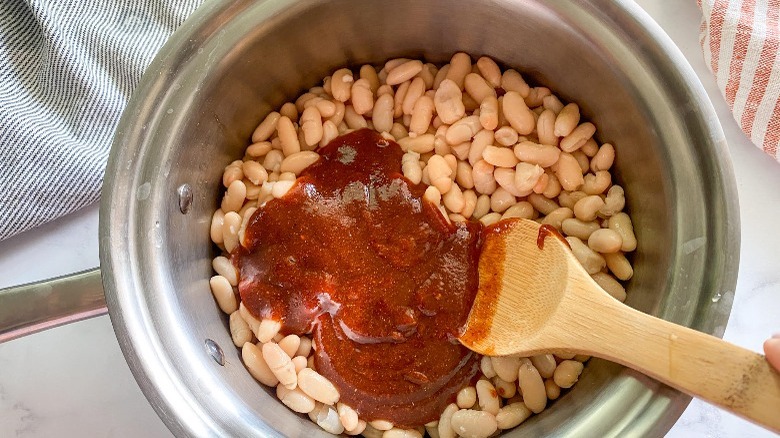 white beans and sauce in a pot