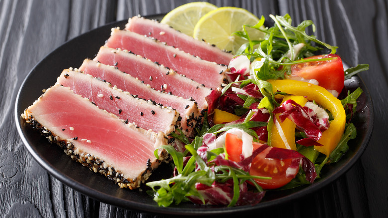 Sliced tuna steak and salad