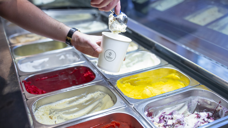 man scooping ice cream