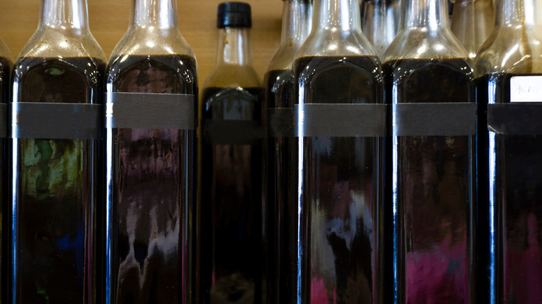 Bottles of grenadine on shelf