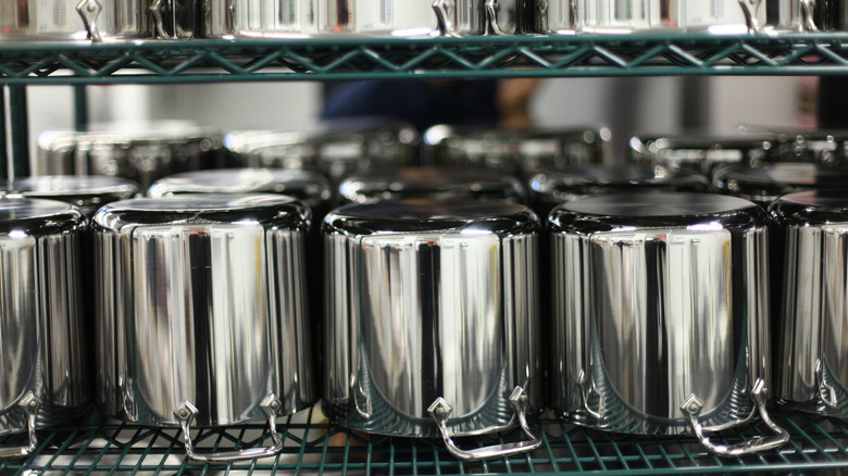 Shelf of All-Clad pots