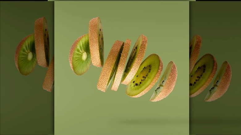 Sliced kiwi suspended in air 