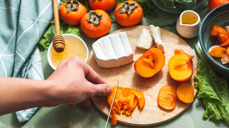 Image of cutting persimmons