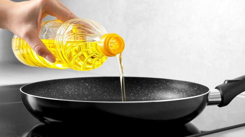 Pouring cooking oil