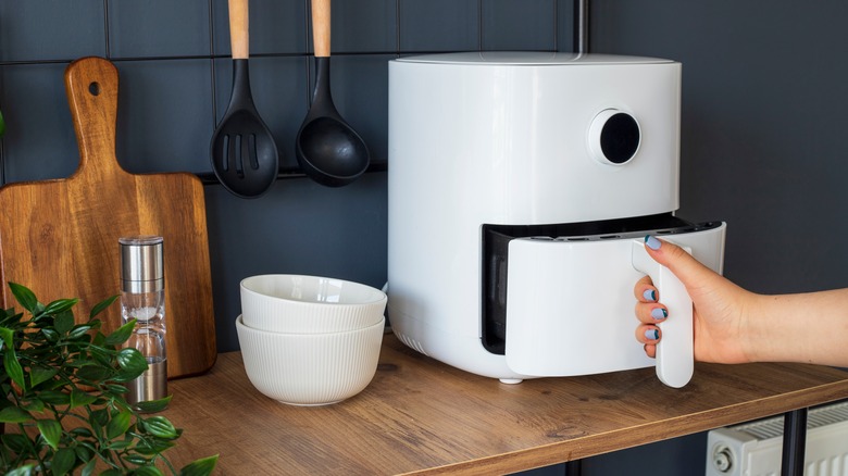 opening air fryer on countertop