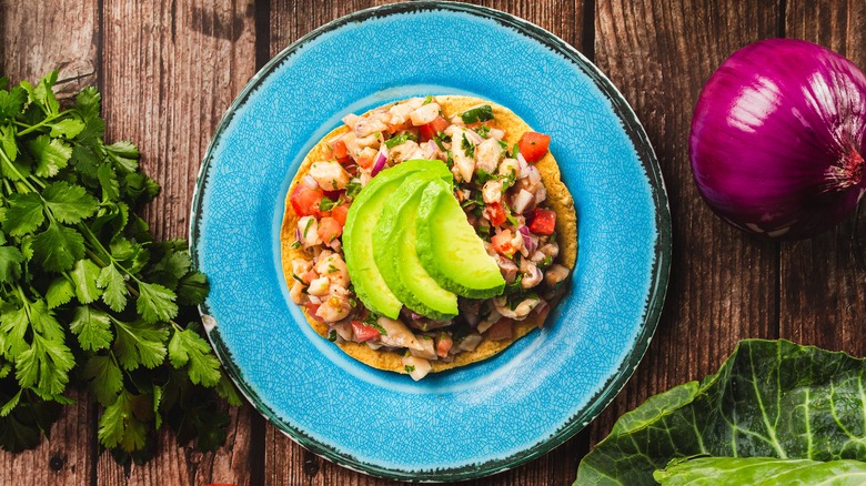 Tostada with shrimp salsa and avocado