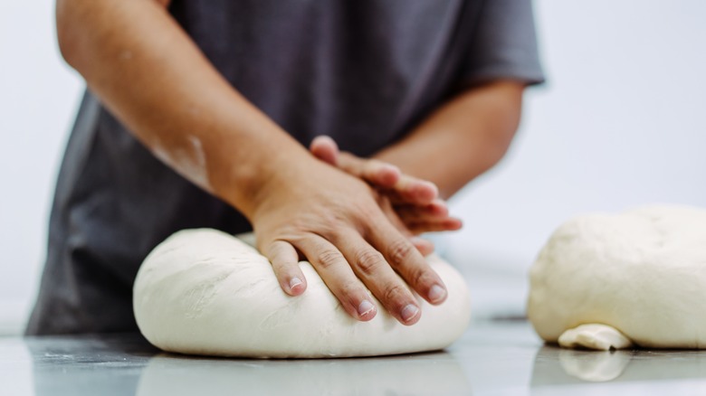 Baker kneading dough