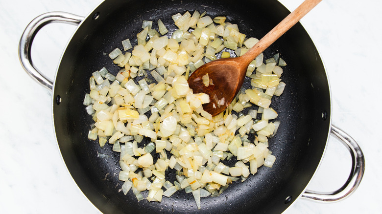 chopped onions frying in pan