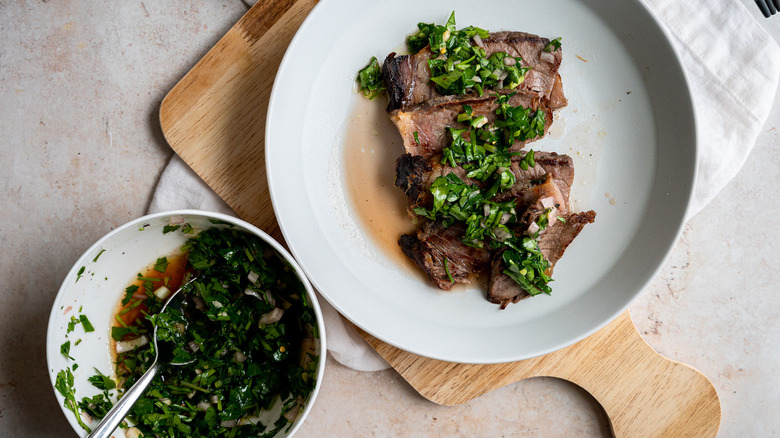 steak with chimichurri and bowl