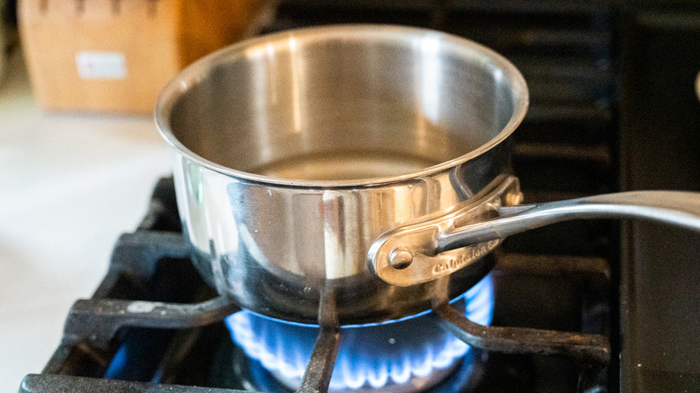 saucepan over flame on stovetop