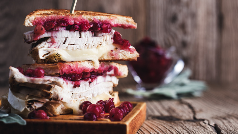 Turkey sandwich with cranberry sauce.