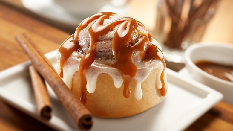 cinnamon roll with icing and caramel