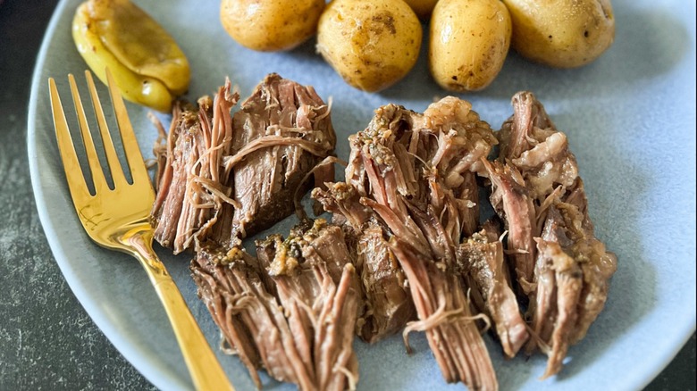 pot roast on plate with potatoes