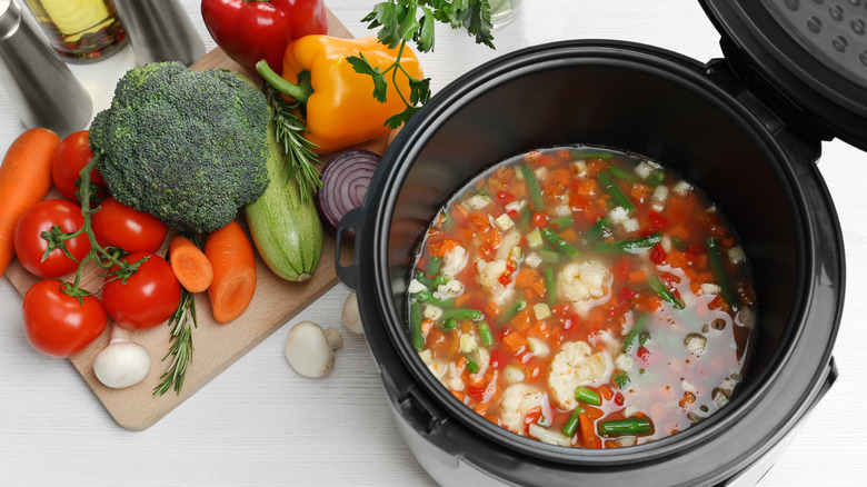 slow cooker and vegetables