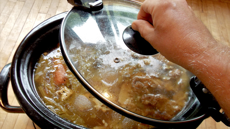 lifting slow cooker lid 