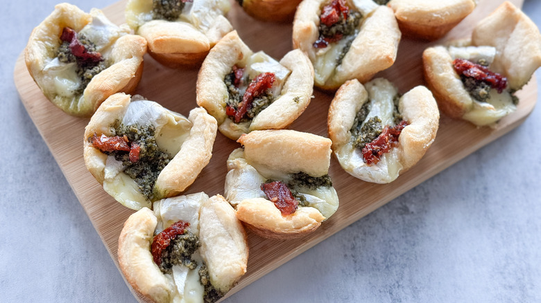 pesto brie bites on charcuterie board