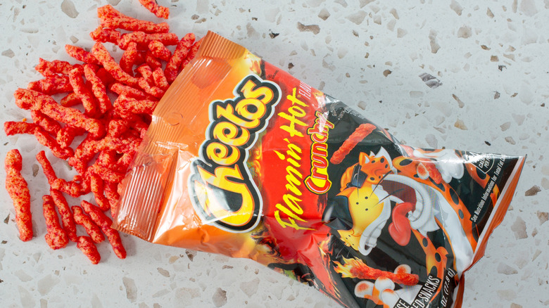 Bag of Flamin' Hot Cheetos with Cheetos falling out.