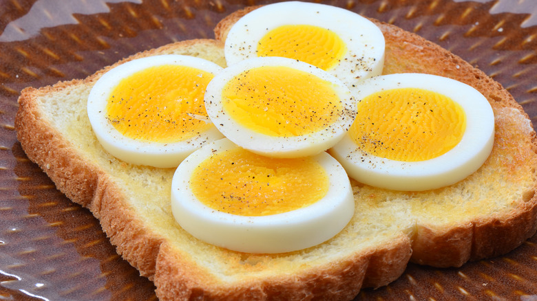 slices of hard-boiled egg on toasted bread