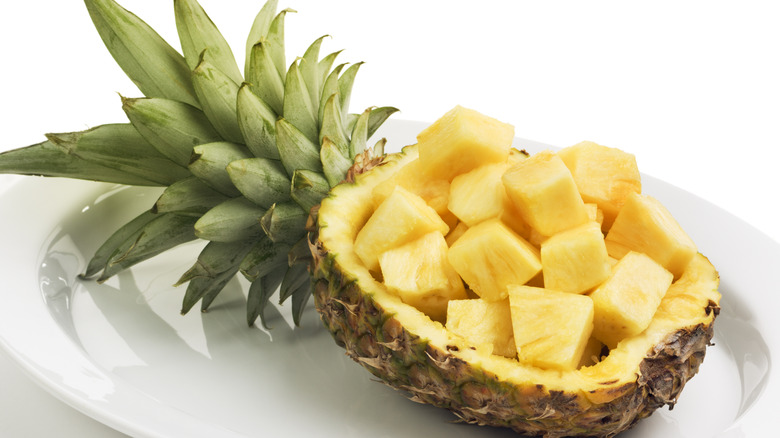 hollowed out pineapple with pineapple chunks