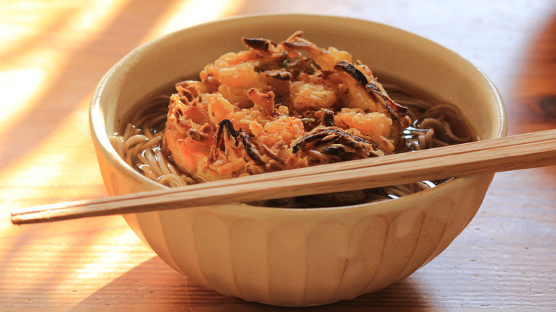 Chopsticks resting on toshikoshi soba bowl