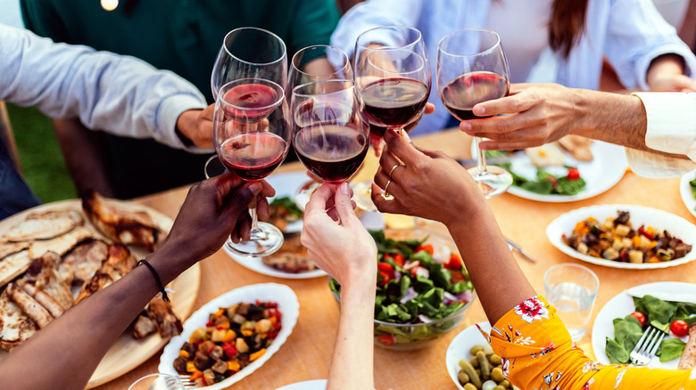 cheers wine glasses at BBQ