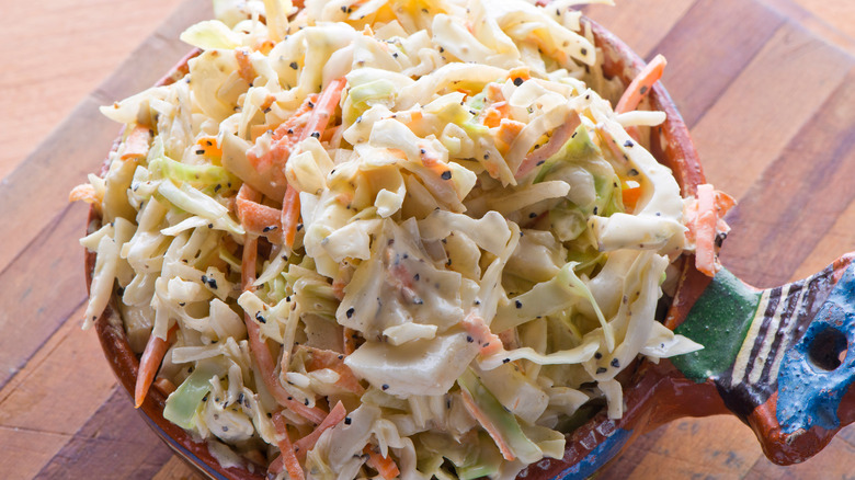 A crock of creamy coleslaw