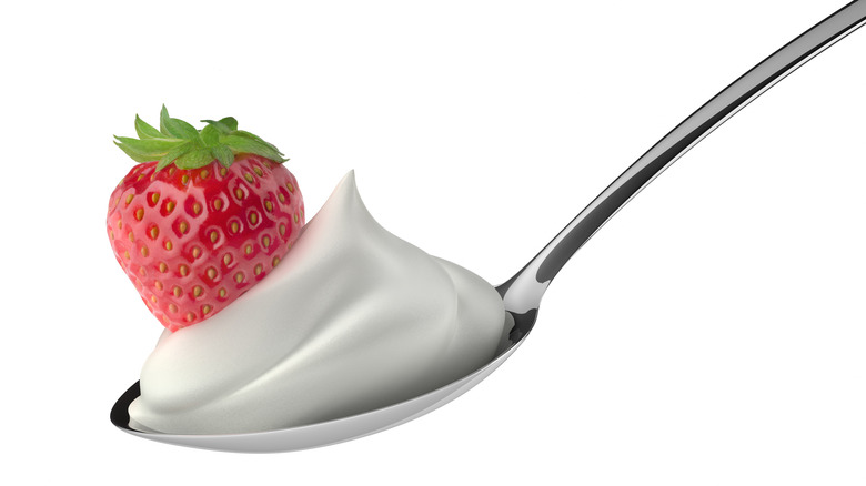 spoonful of whipped cream and strawberry