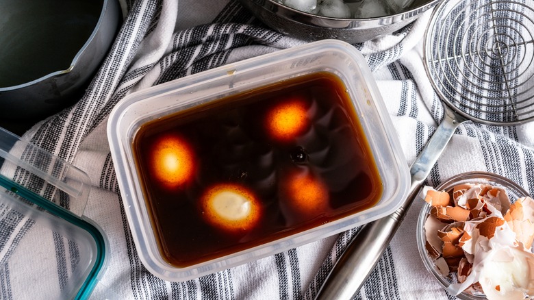 Soft-boiled eggs marinating in soy