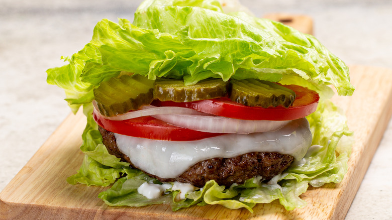 burger with lettuce leaves as the bun