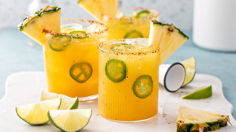 Spicy pineapple and jalapeno margaritas with lime