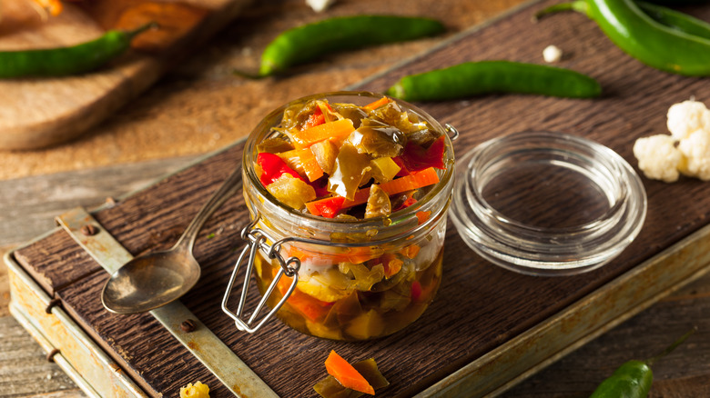 jar of giardiniera wood cutting board