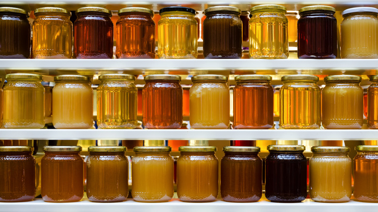 Rows of different honey jars