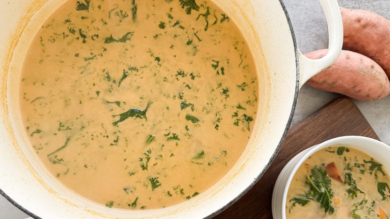 spiced sweet potato and kale stew in pot