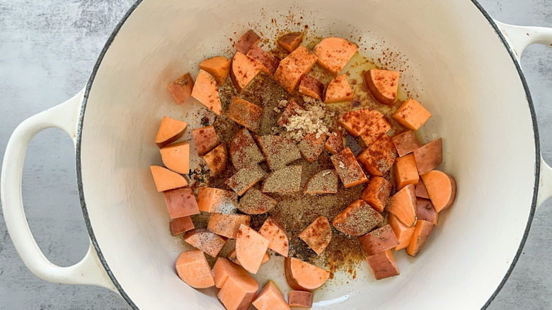 sweet potatoes and spices bloom in pot