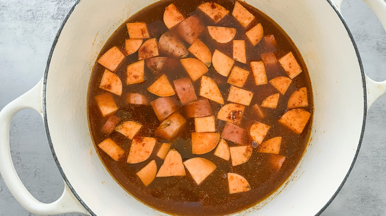 sweet potatoes and broth in pot