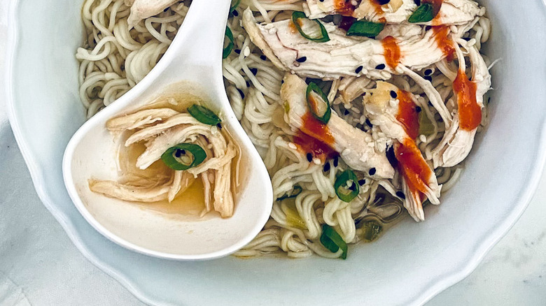 chicken soup with ladle spoon