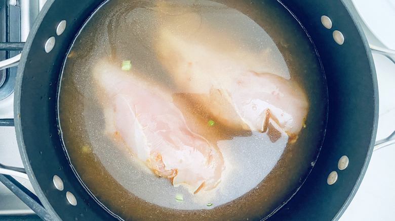 chicken and broth in pot