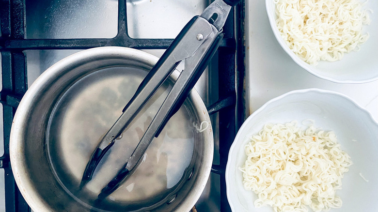 pot and bowls of noodles