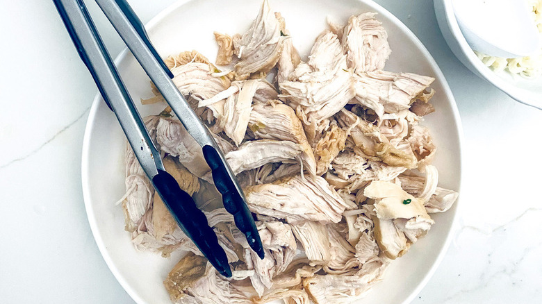 shredded chicken and tongs