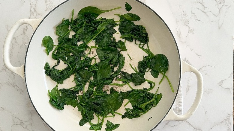 sautéed spinach in large skillet